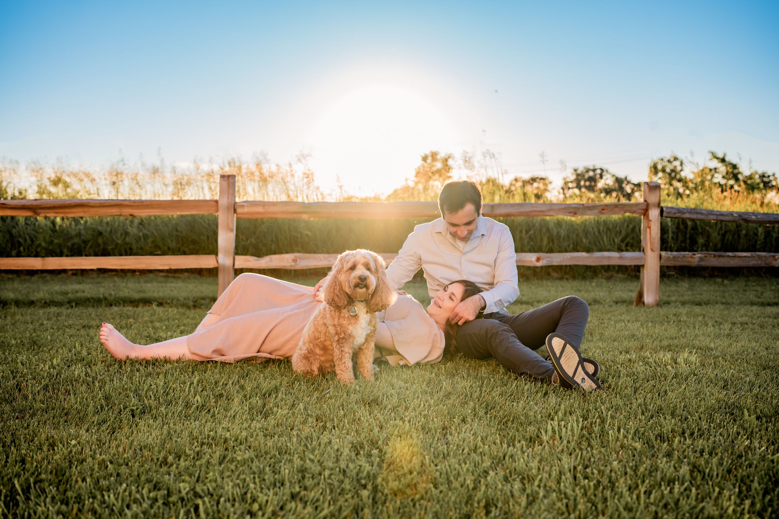 Flowing maternity gown on a pregnant woman, captured during a sunset maternity session.