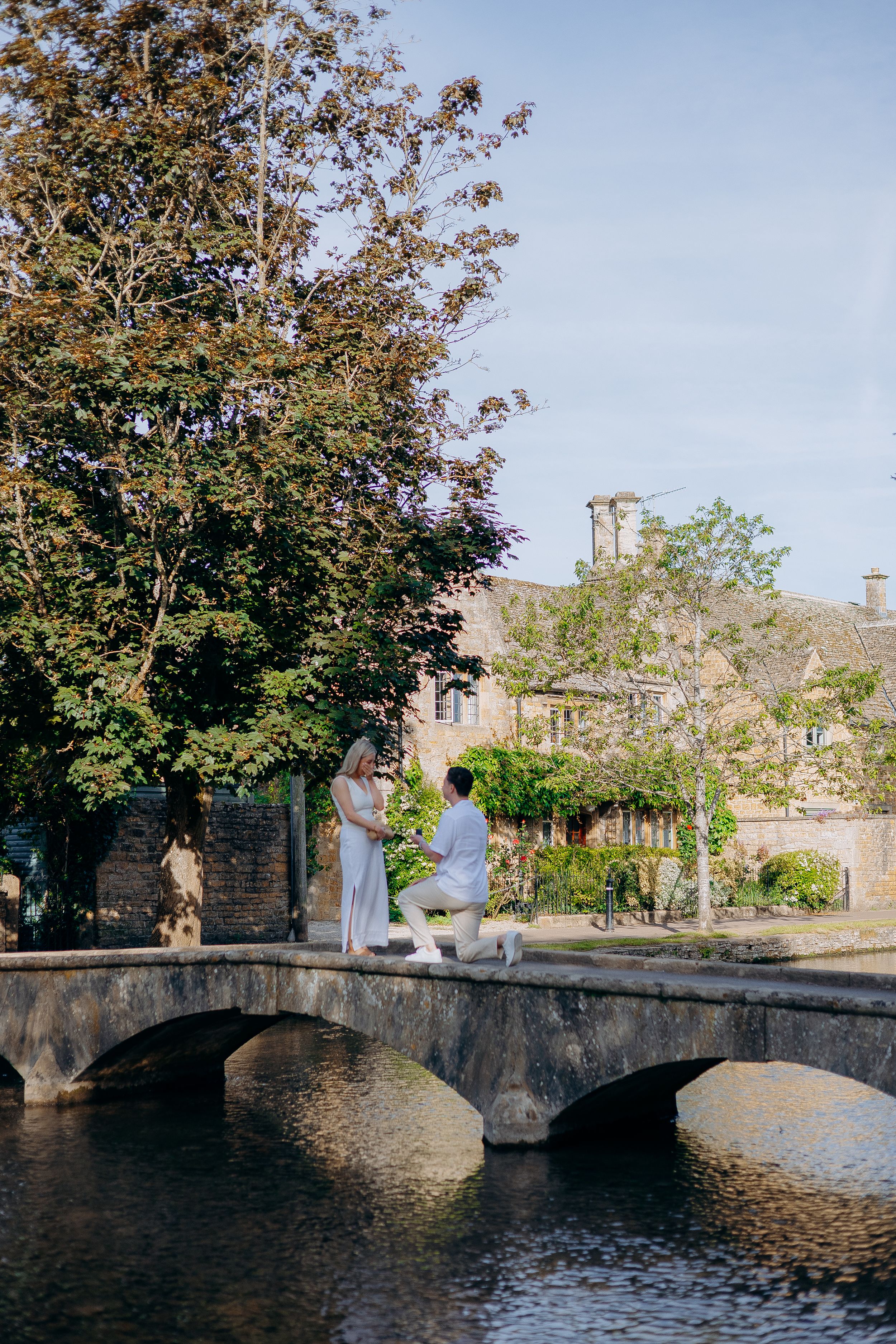 Proposal photography in Bourton-on-the-Water beside the river.