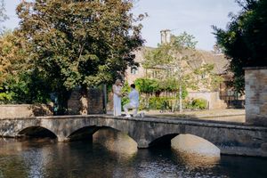 Natural engagement photography after a surprise proposal in Bourton-on-the-Water.