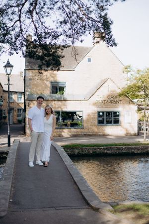 Newly engaged couple photographed in Bourton-on-the-Water village.