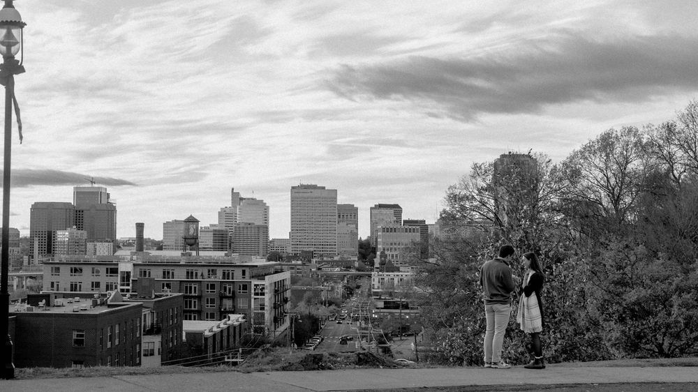 Black & White Engagement at Libby Hill Park in Richmond, Virginia with the city of Richmond in the background.