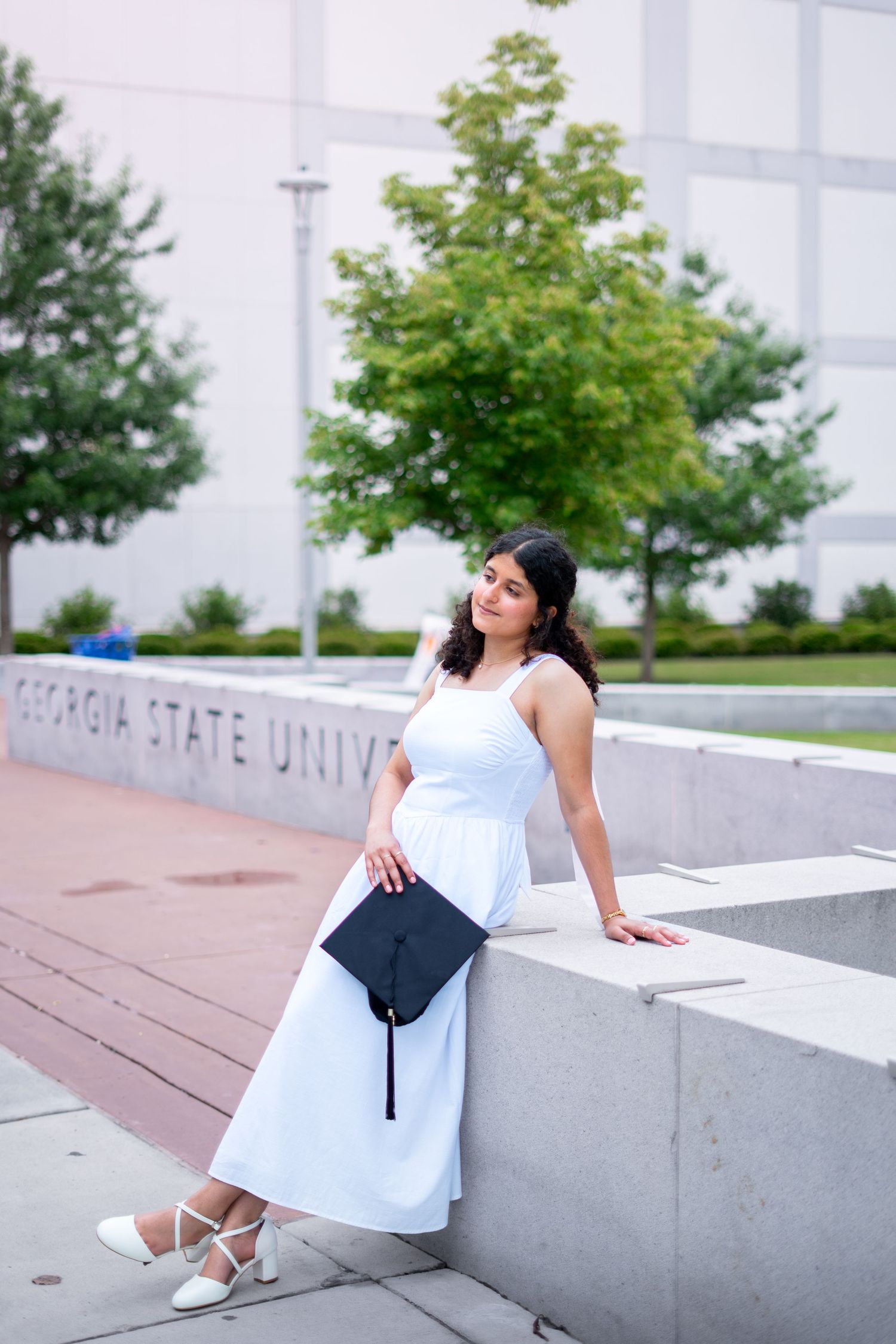 Georgia State graduation photos in front of the iconic GSU library greenway, one of the best spots on the Atlanta campus