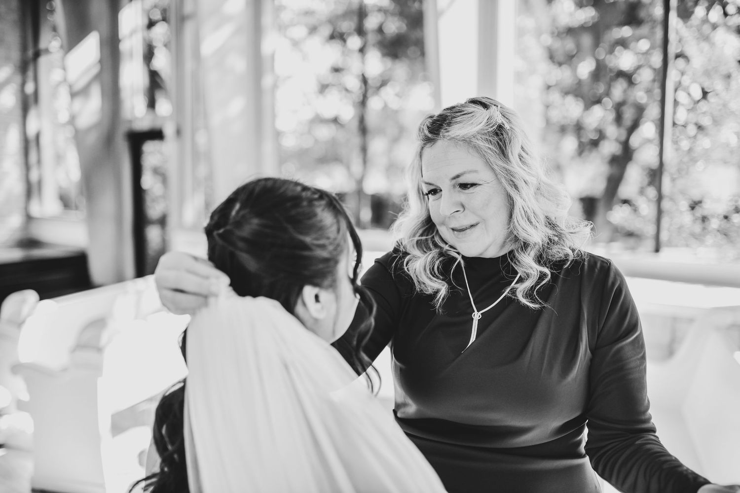 Emotional mother daughter wedding moment inside Brighton Abbey chapel