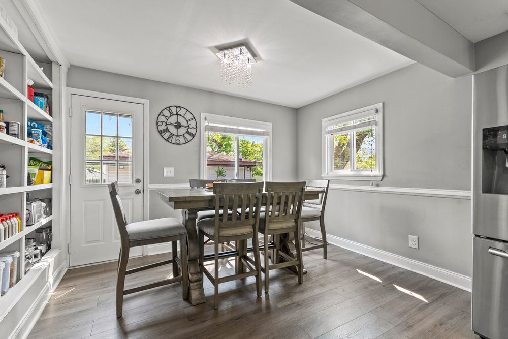 Dining room with crystal chandelier and built-in shelving in Dearborn Michigan home on Academy Street