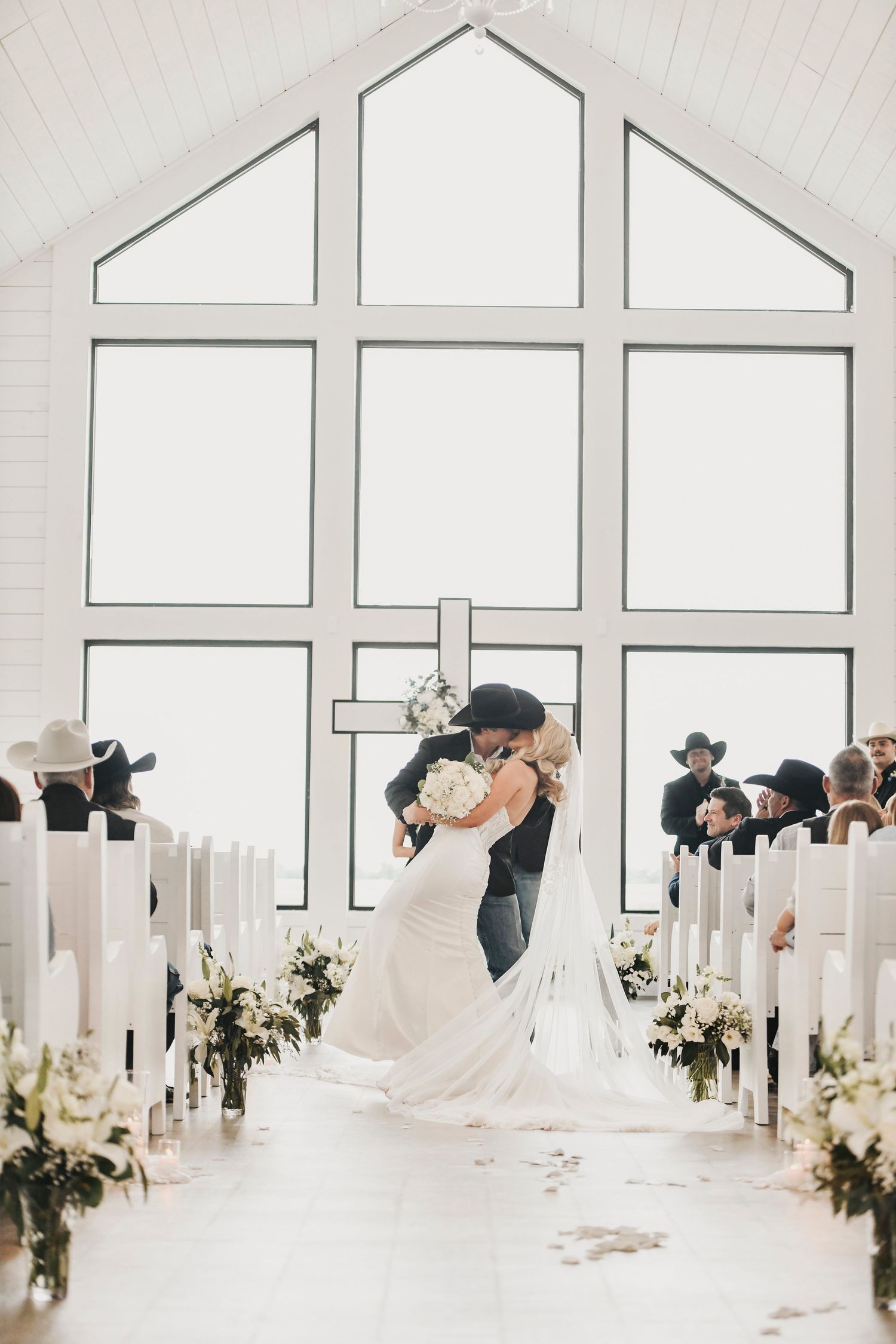 Wedding ceremony inside The Gardenia chapel in Valley View Texas