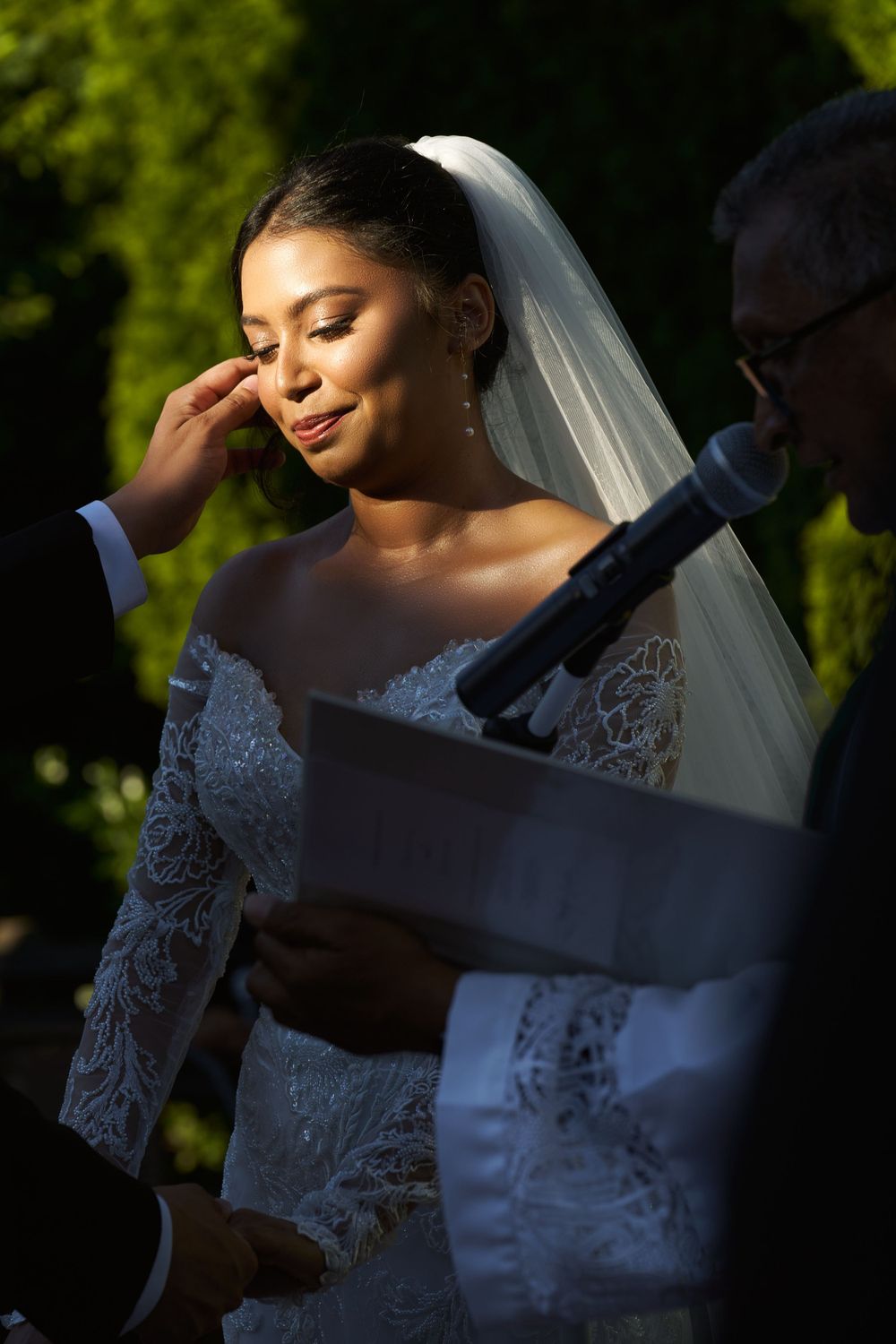 Wedding photography session capturing soft natural light and shadows on bridal details.
