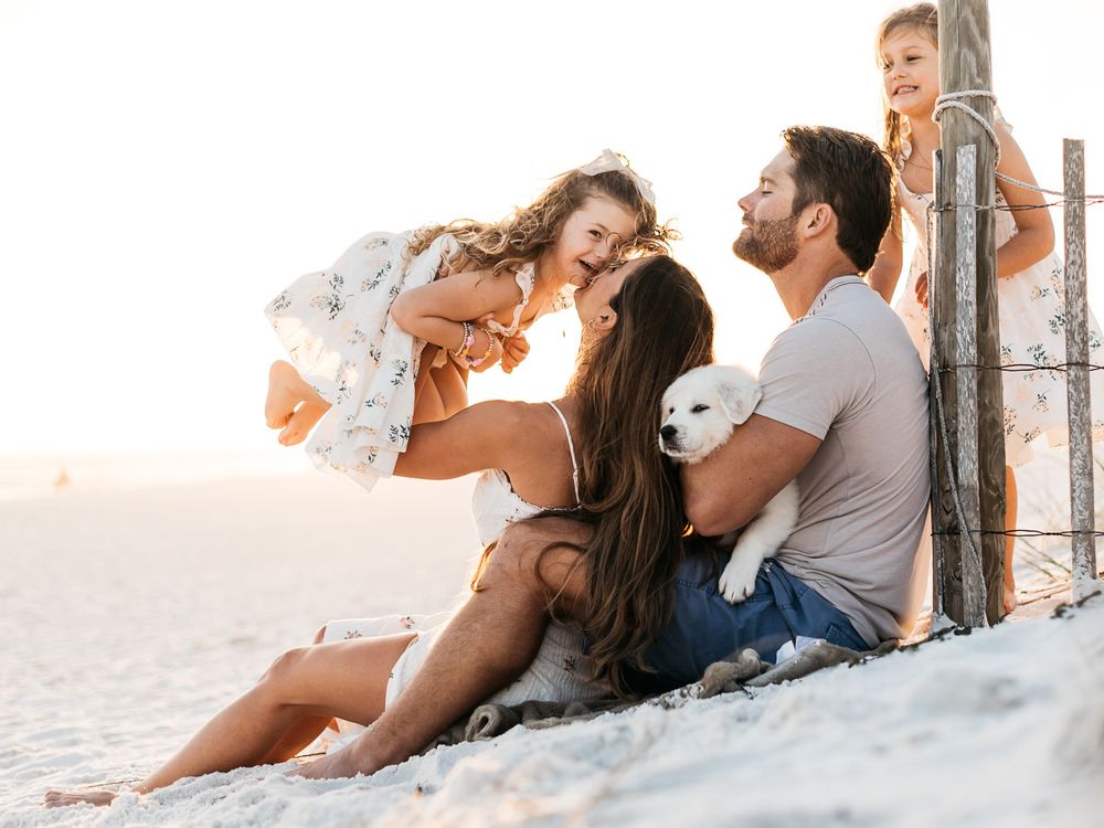 Family friendly photographer captures candid love of vacation on the beach during sunset. Best Photographer near me and highly rated.