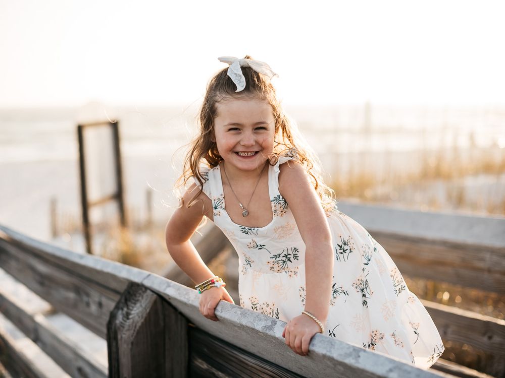 Playing on the beach during sunset with professional family photographer. Matt Johnson Photography