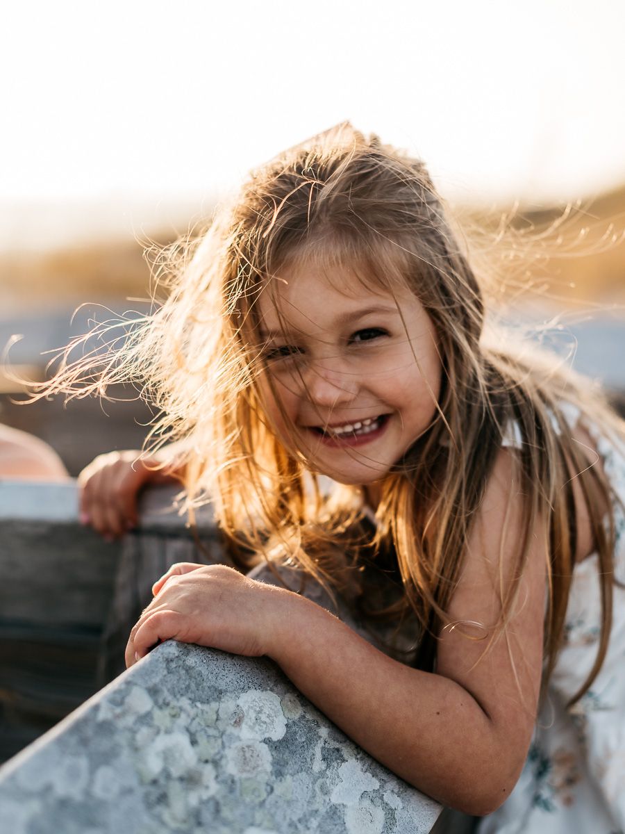 Playing on the beach during sunset with a professional family photographer. Matt Johnson Photographer.