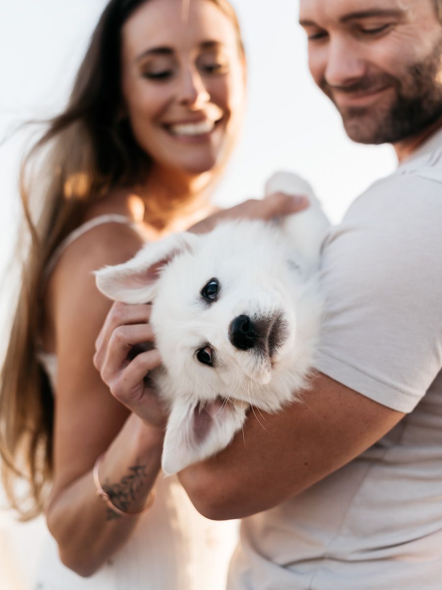 Welcoming the new family addition on the beach during sunset with MJ Photograph