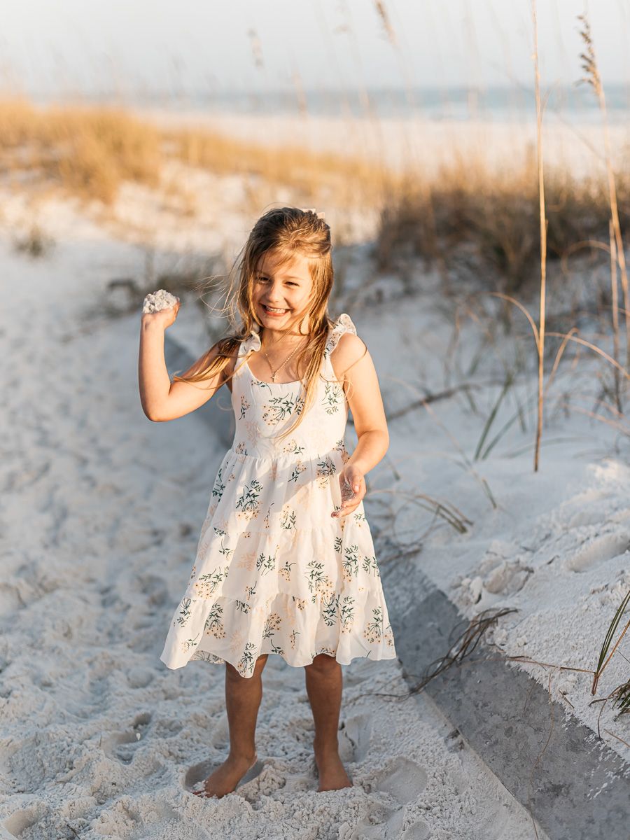 Playing on the beach during sunset with a professional family photographer. Matt Johnson Photographer.