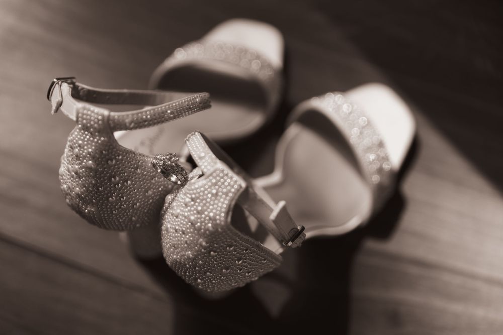 black and white wedding heels with ring nestles in between - for summer backyard wedding in Ohio photography by Vicci Photo Dayton Ohio Phot