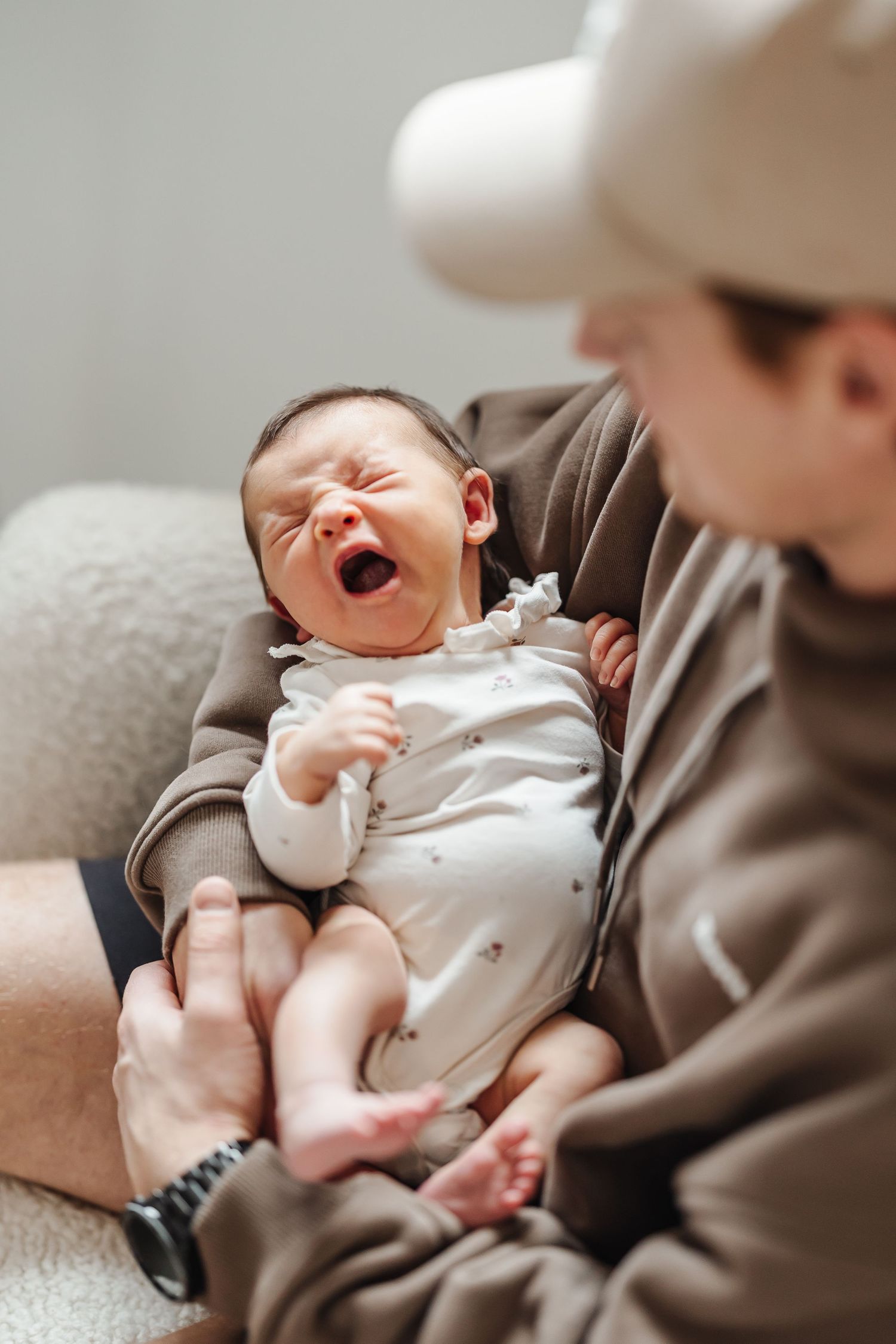 Candid lifestyle photography session for a newborn light and airy photoshoot with baby in a Kelowna, BC home.