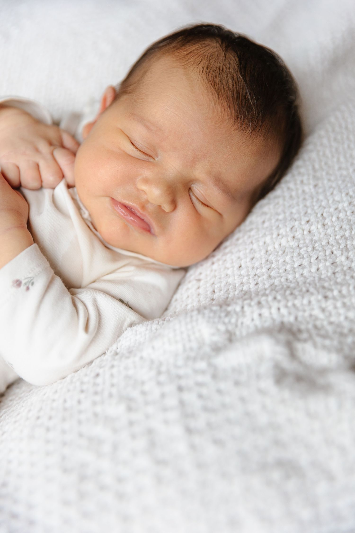 Sleeping Newborn baby photos taken at home for a bright and airy soft lighting lifestyle newborn photography photoshoot in Kelowna, BC.