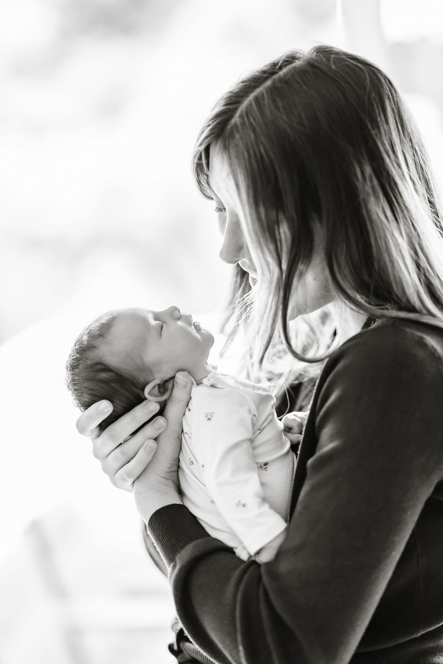Black and white photoshoot at home for lifestyle newborn photography session in Kelowna, BC house.