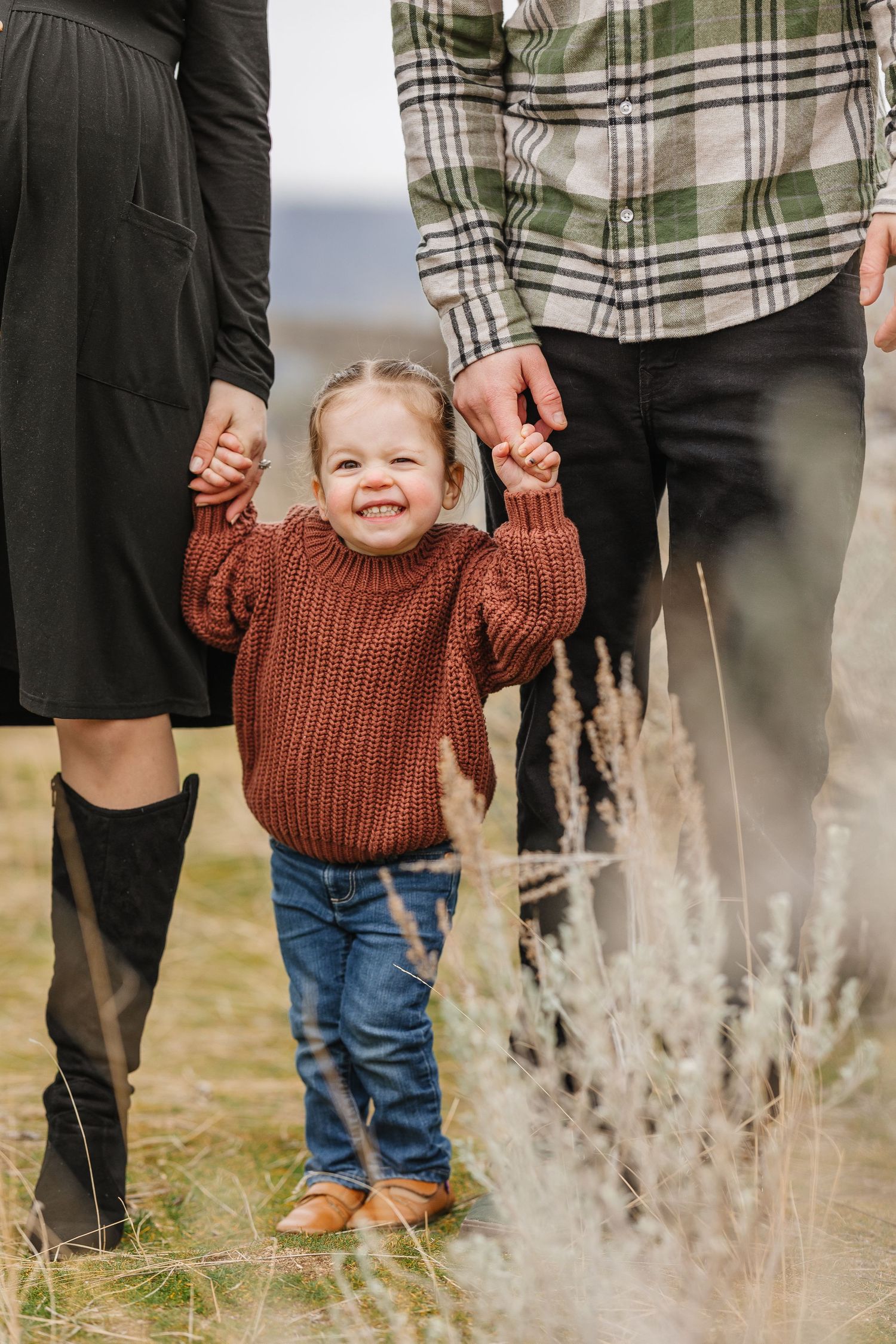 close up of child smiling during family photos at Knox mountain park in Kelowna bc