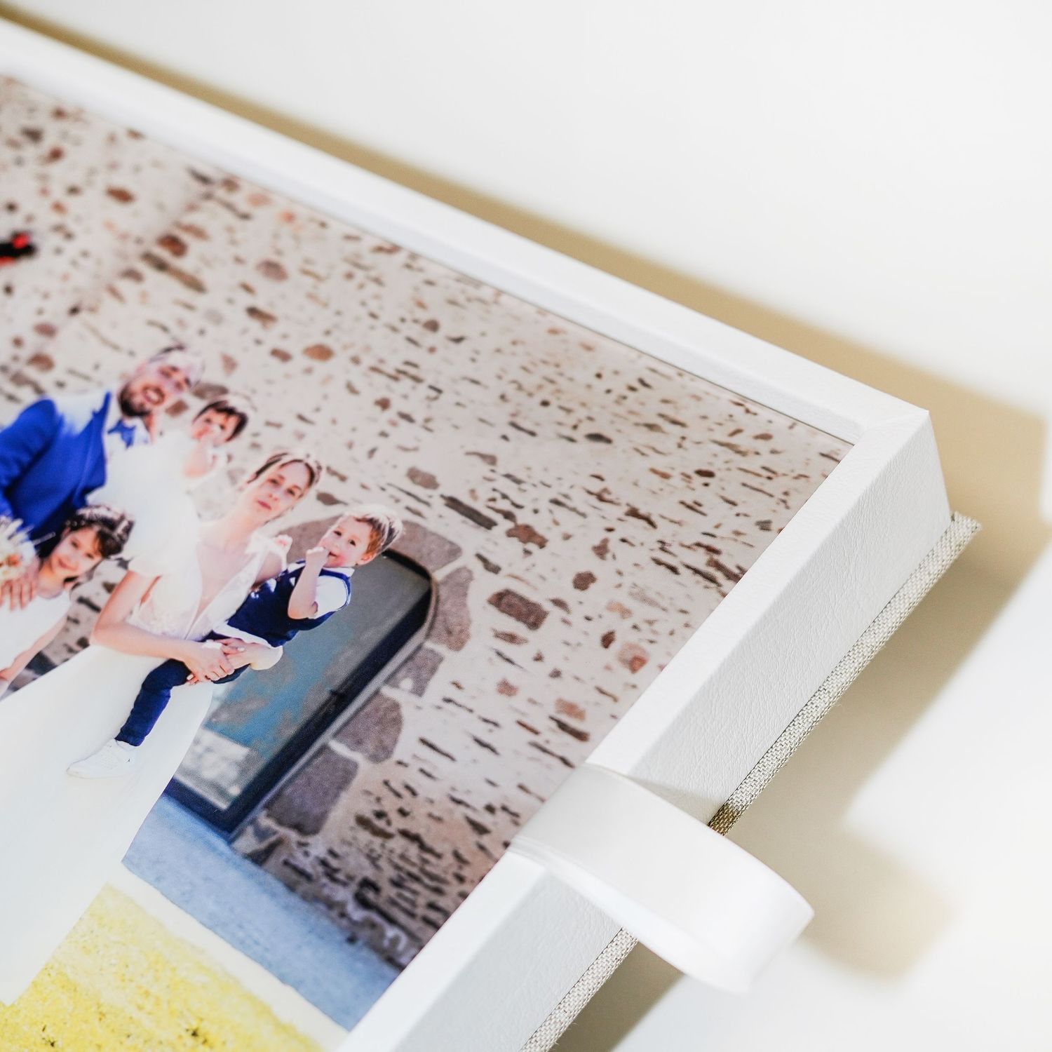 Wedding photo album page with white mounting corners.