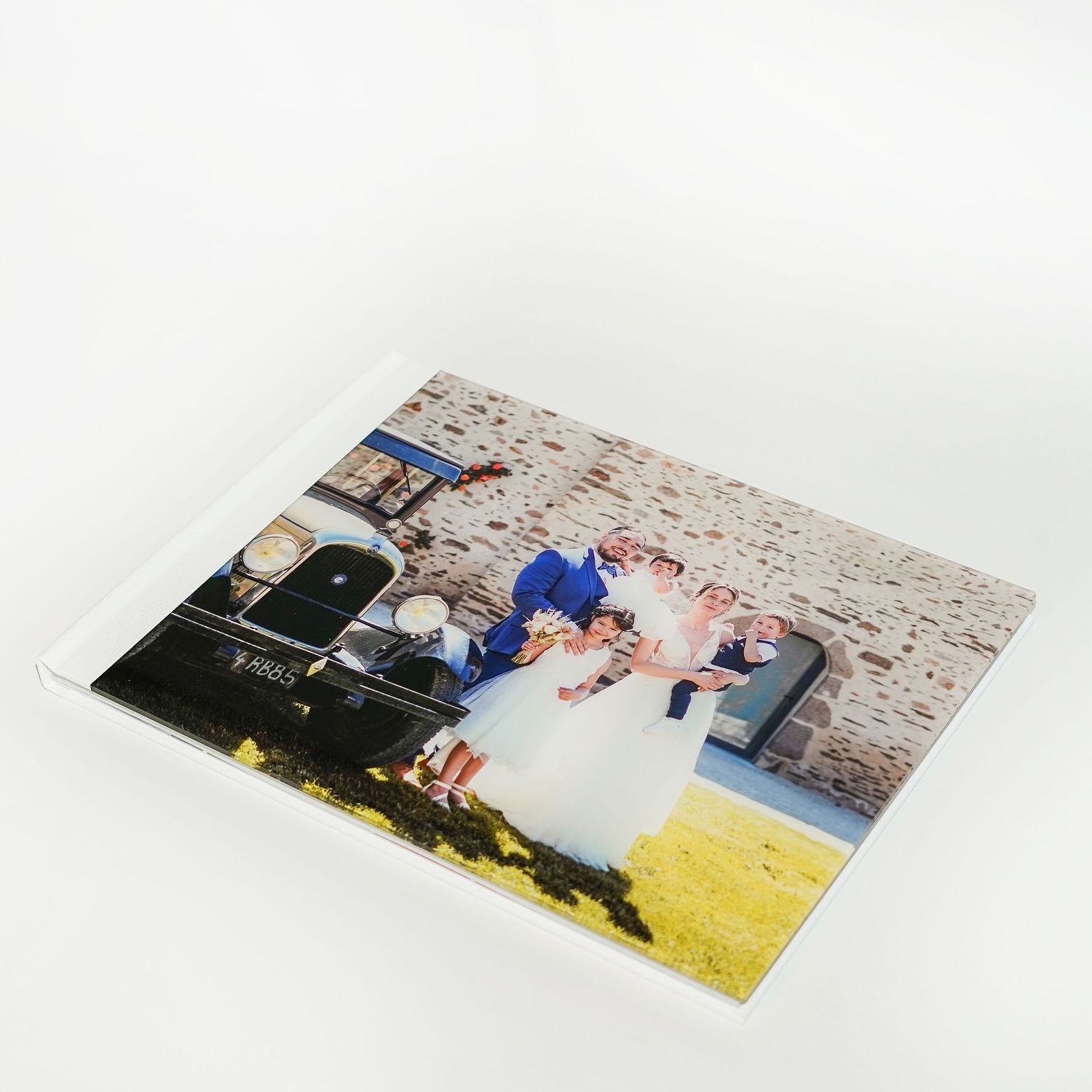 Wedding photograph mounted in a professional album with white border.