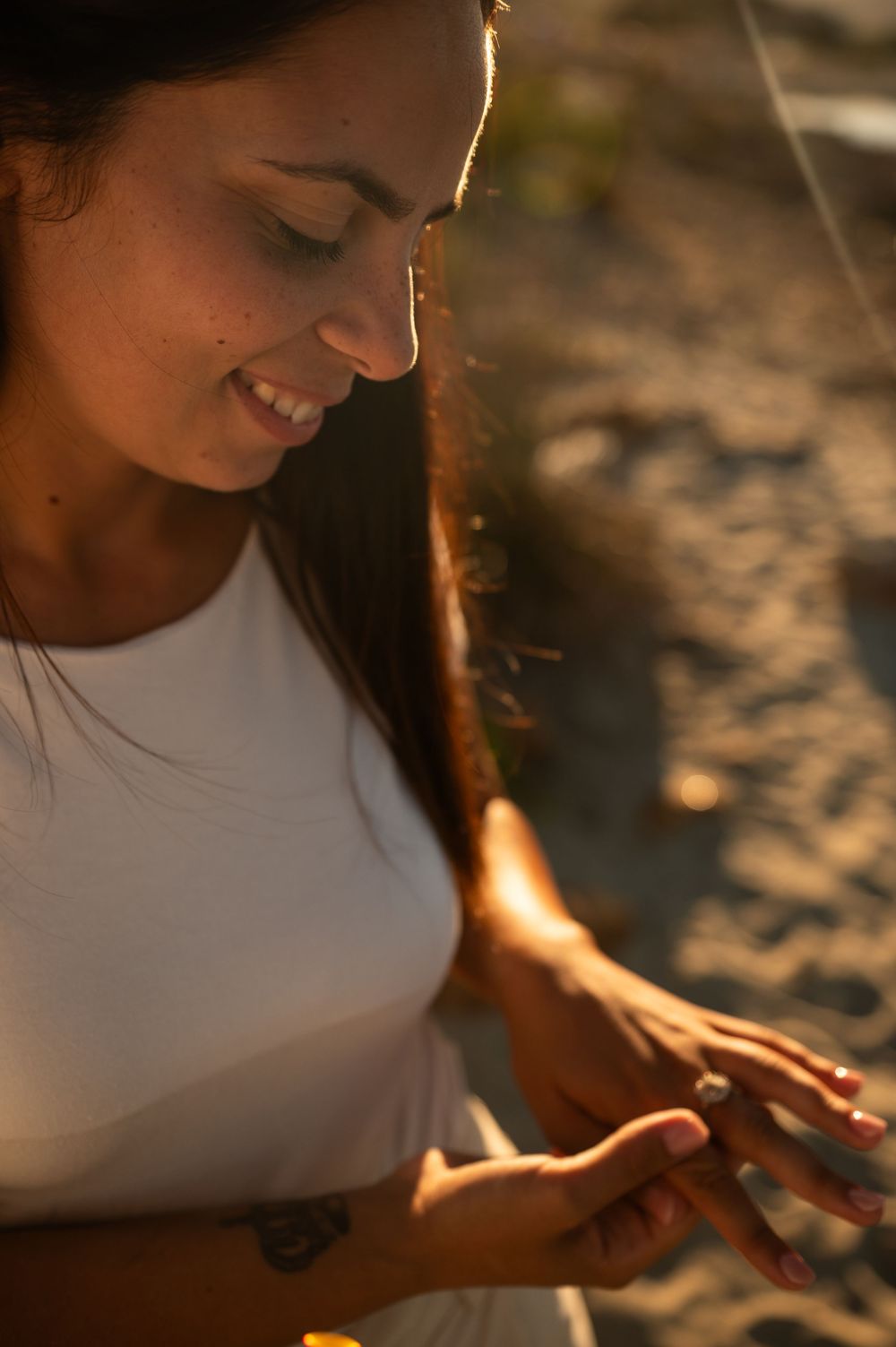 Joyful expressions captured in warm sunlight at the beach.