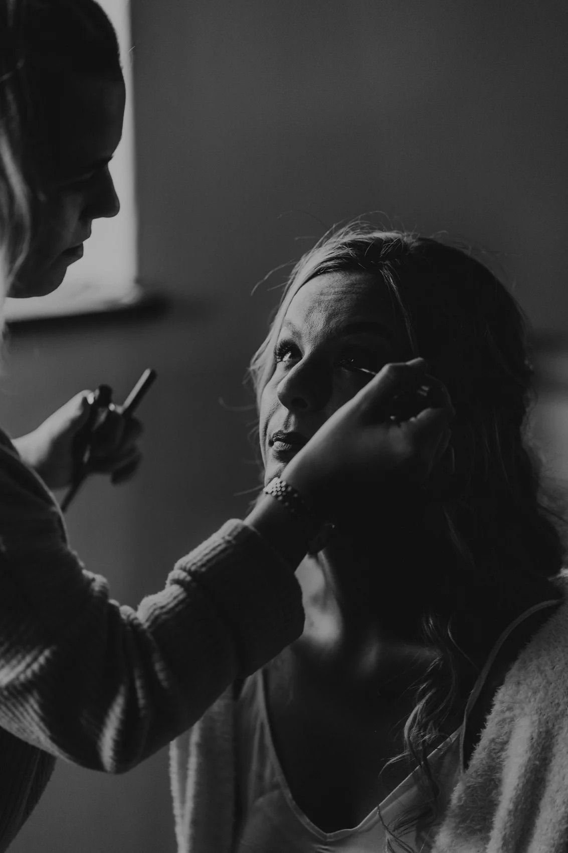 Black and white silhouettes of a couple in intimate close-up shots.