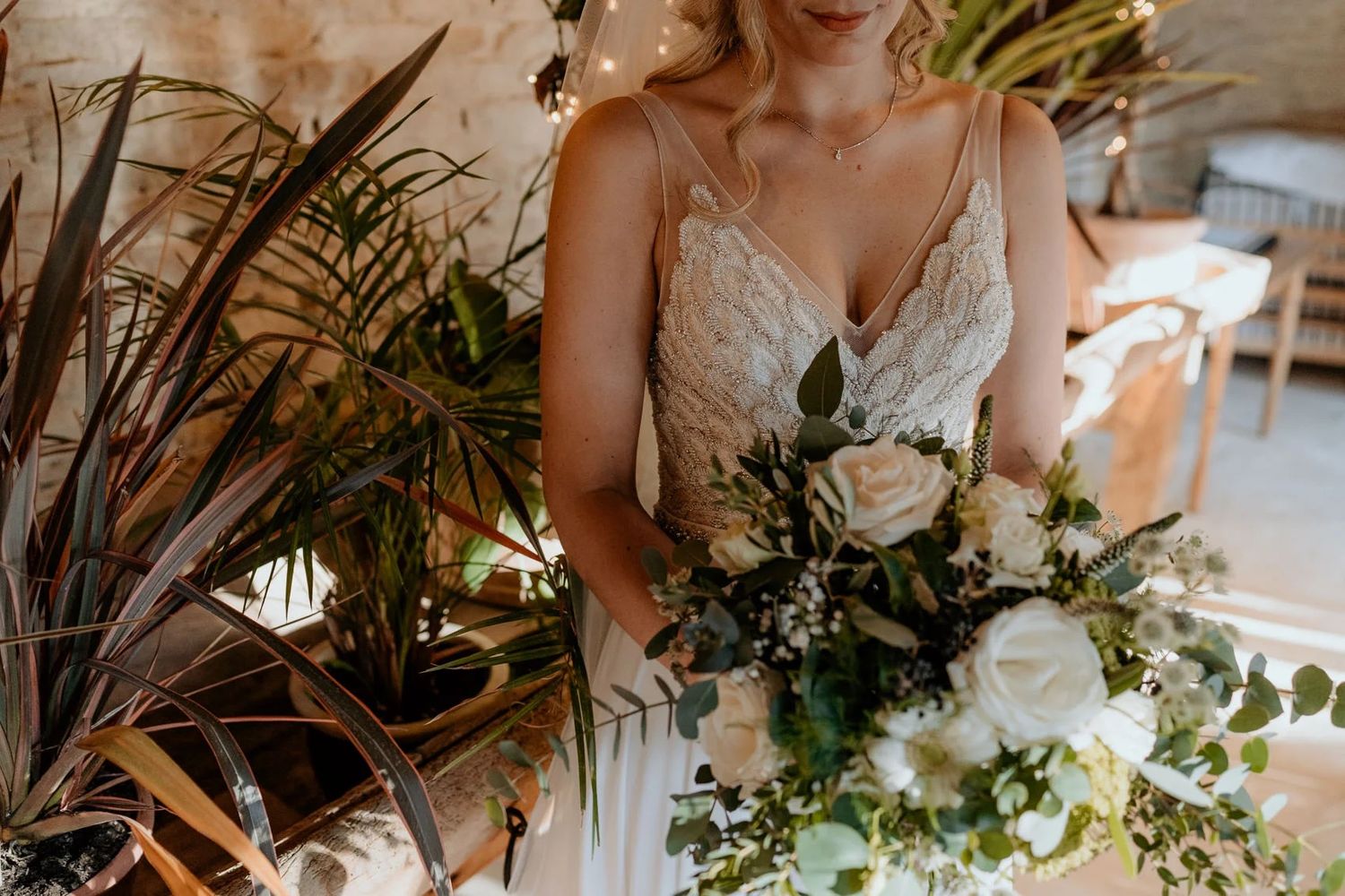 Elegant wedding decor with flowing greenery and floral arrangements.