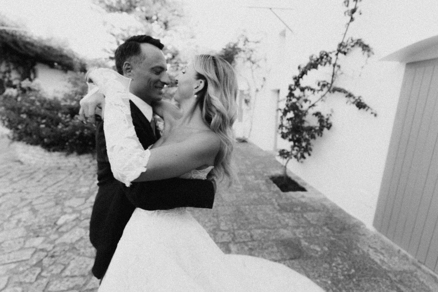 A black and white photo series showing a romantic dance dip sequence between a couple in formal attire.