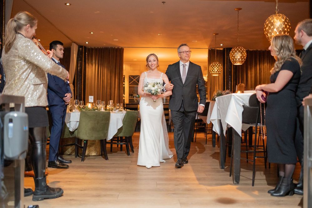 Restaurant e18hteen wedding ceremony first kiss at fireplace