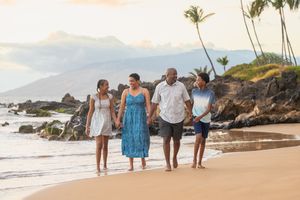 Maui family photographer photo against beautiful Maui sunset beach by ohwowfotos.