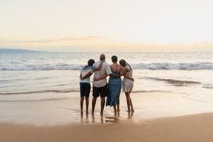 Maui family photographer photo against beautiful Maui sunset beach by ohwowfotos.