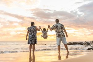Maui family photographer photo against beautiful Maui sunset beach by ohwowfotos.