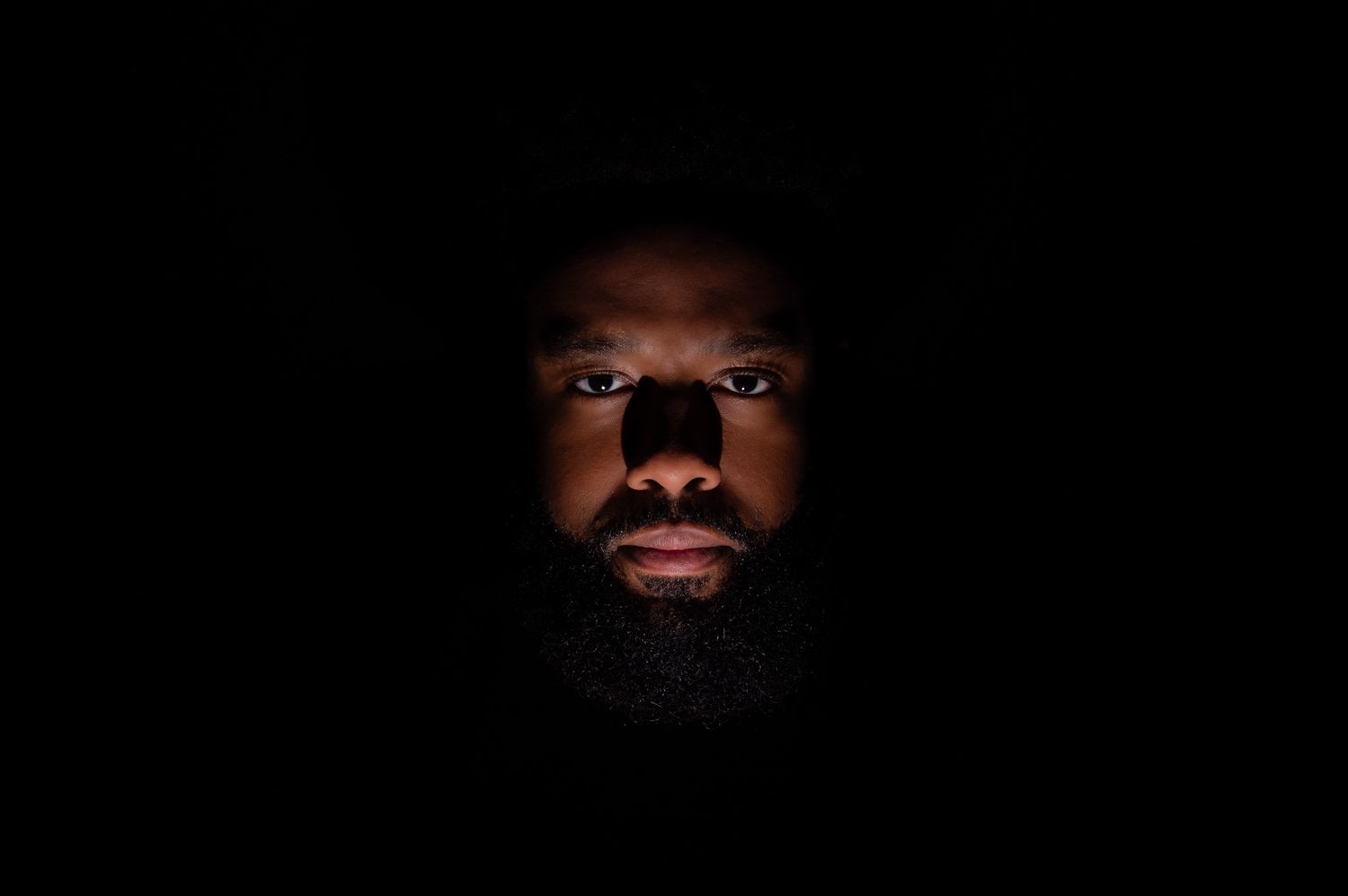 A series of dark artistic portraits showing fragments of faces and silhouettes against black backgrounds.