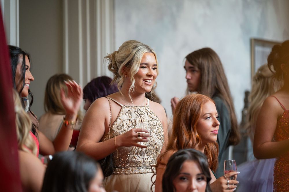 Candid moments of guests enjoying themselves during a formal celebration.