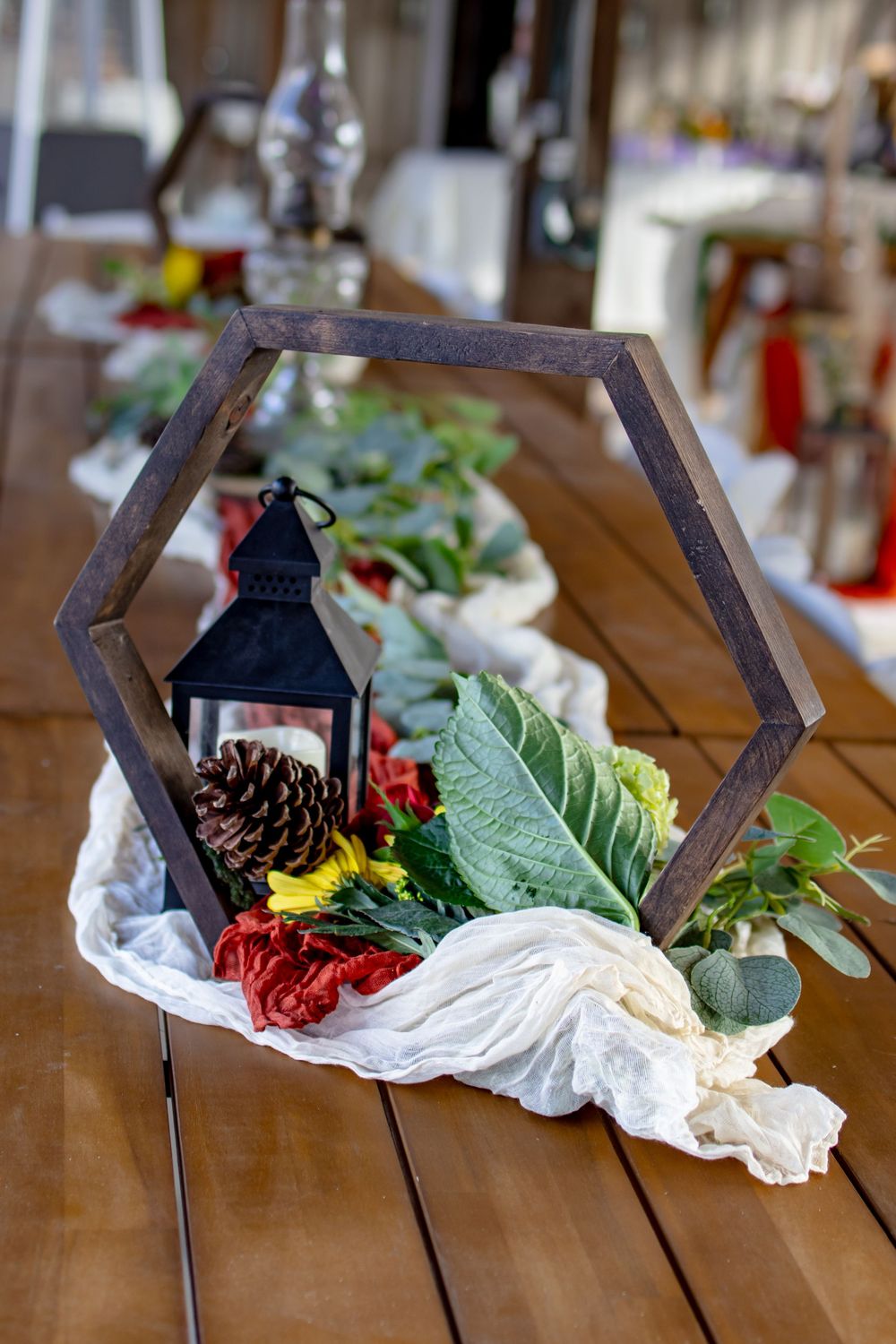 lantern center piece on a wood table