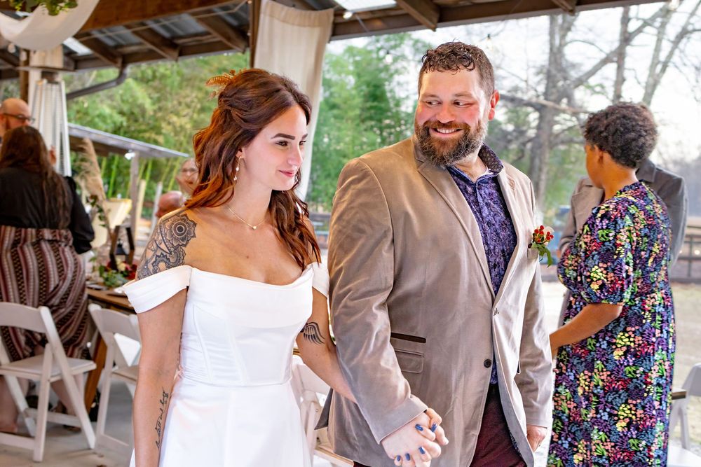 a bride and groom walking down the isle