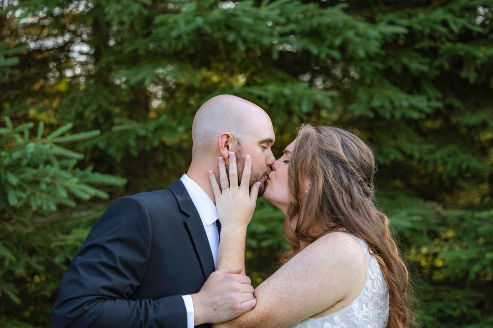 A romantic wedding photo collage showing six intimate moments between a newlywed couple in a lush outdoor setting.