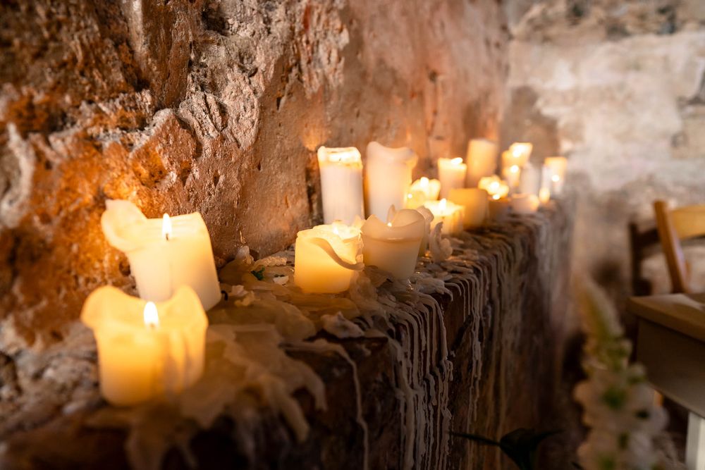 Candles on the ledge in the chapel at Ash Barton Estate in Devon.