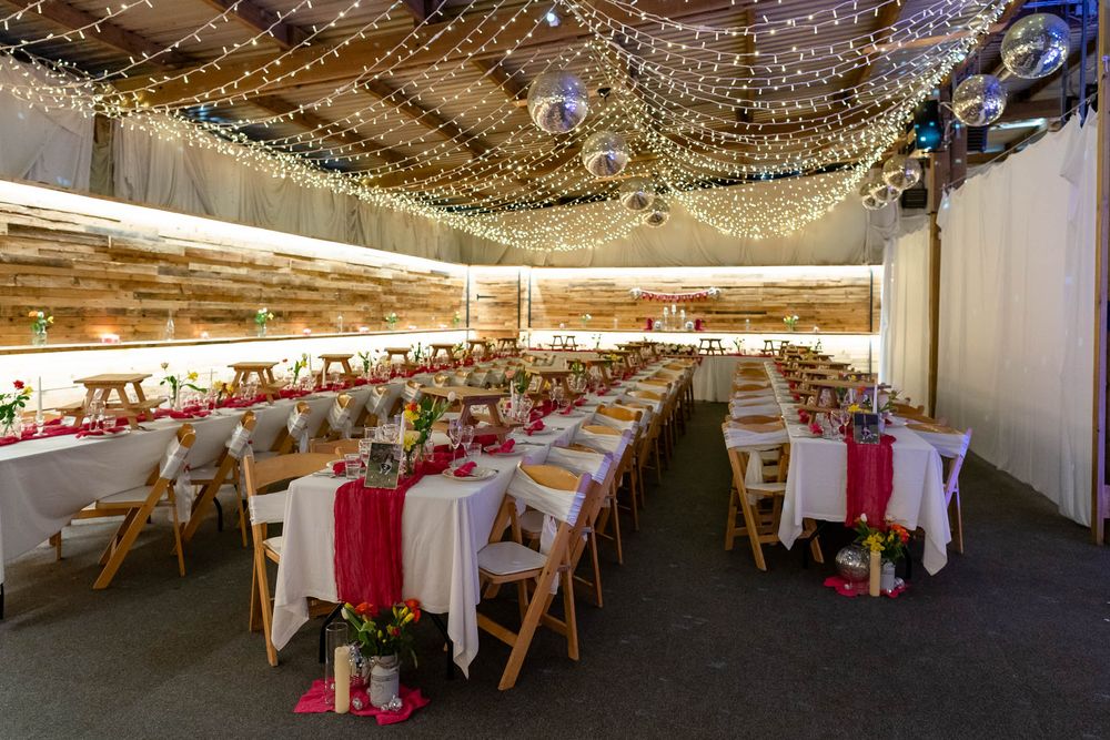 Dining tables set up in the reception area at Ash Barton Estate for a Wedding breakfast.