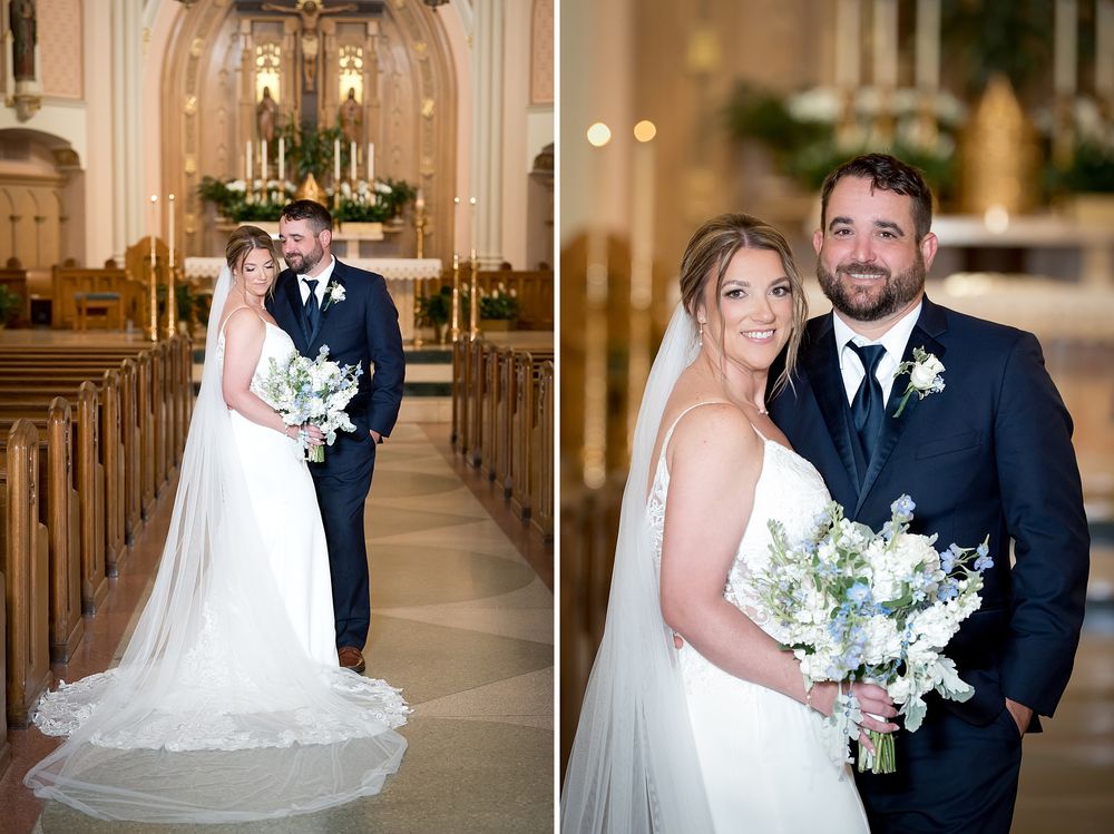 Bride and groom pose together inside a church aisle, bride holding a white and blue bouquet in elegant wedding attire.