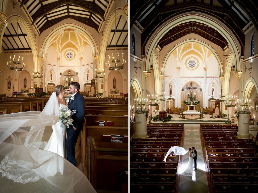 Bride and groom share a romantic moment in an elegant church aisle, with a flowing veil and stunning altar backdrop.