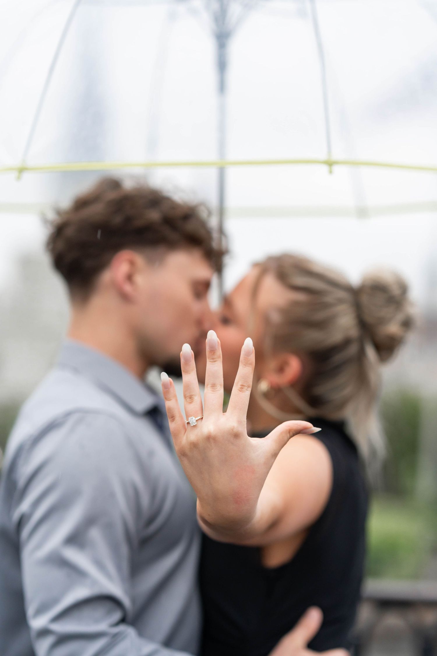 engaged couple with engagement ring