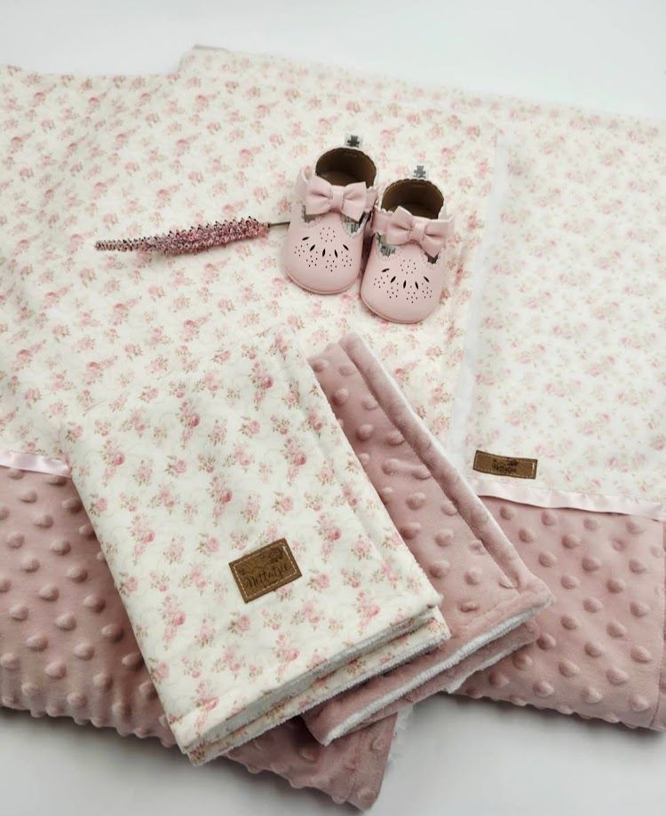 Pink floral baby blanket set with matching bag and white bunny plush toy, perfect for newborns.