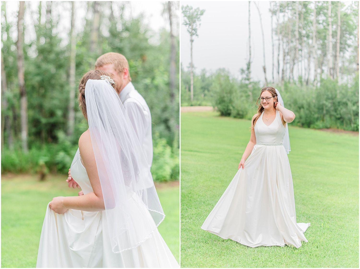 Groom lifts bride in white gown and veil on lush green lawn surrounded by tall trees.