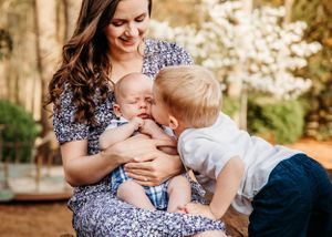 Tender moments shared between family members in a sunlit outdoor setting.
