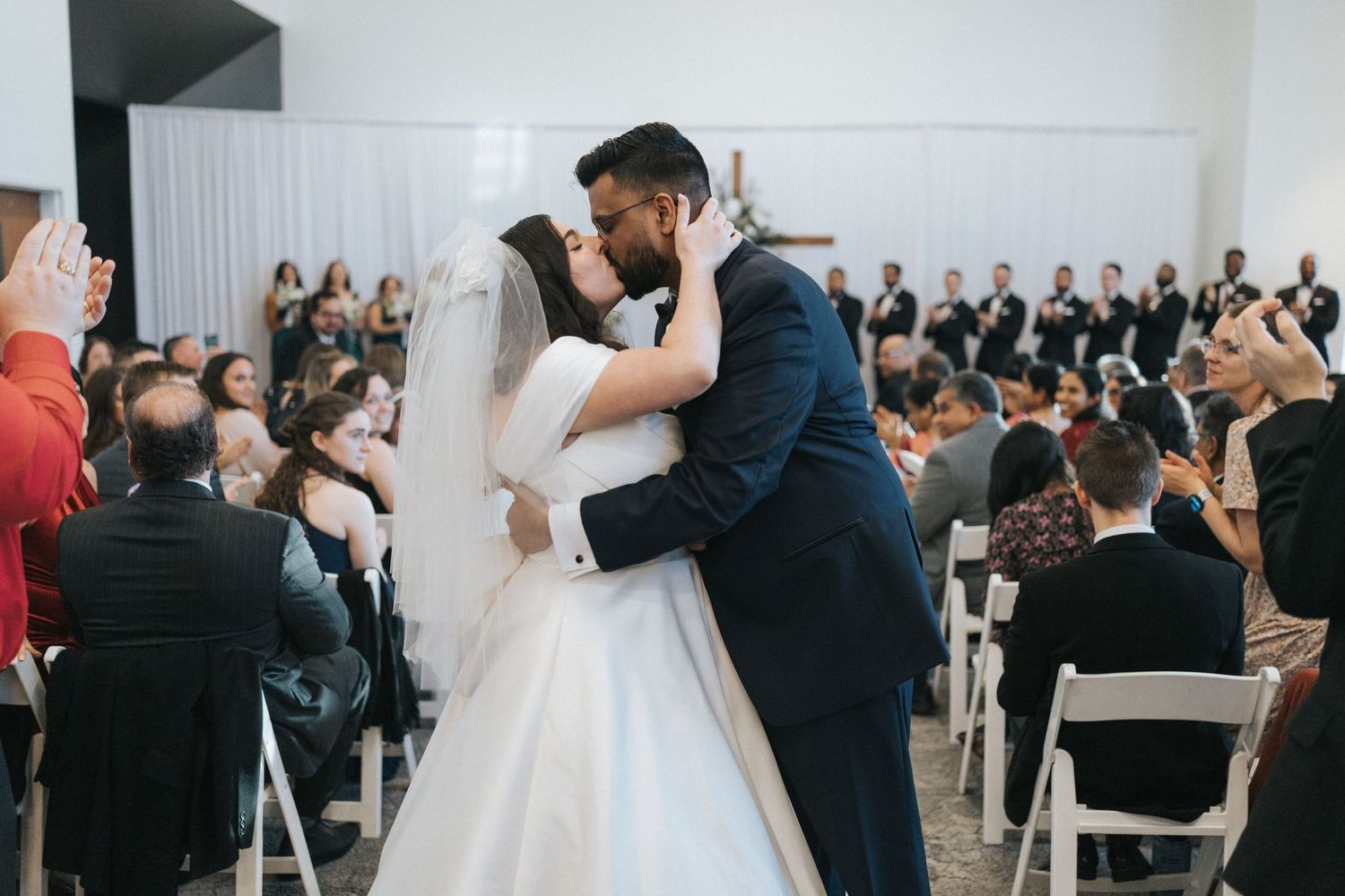 couple kissing at wedding