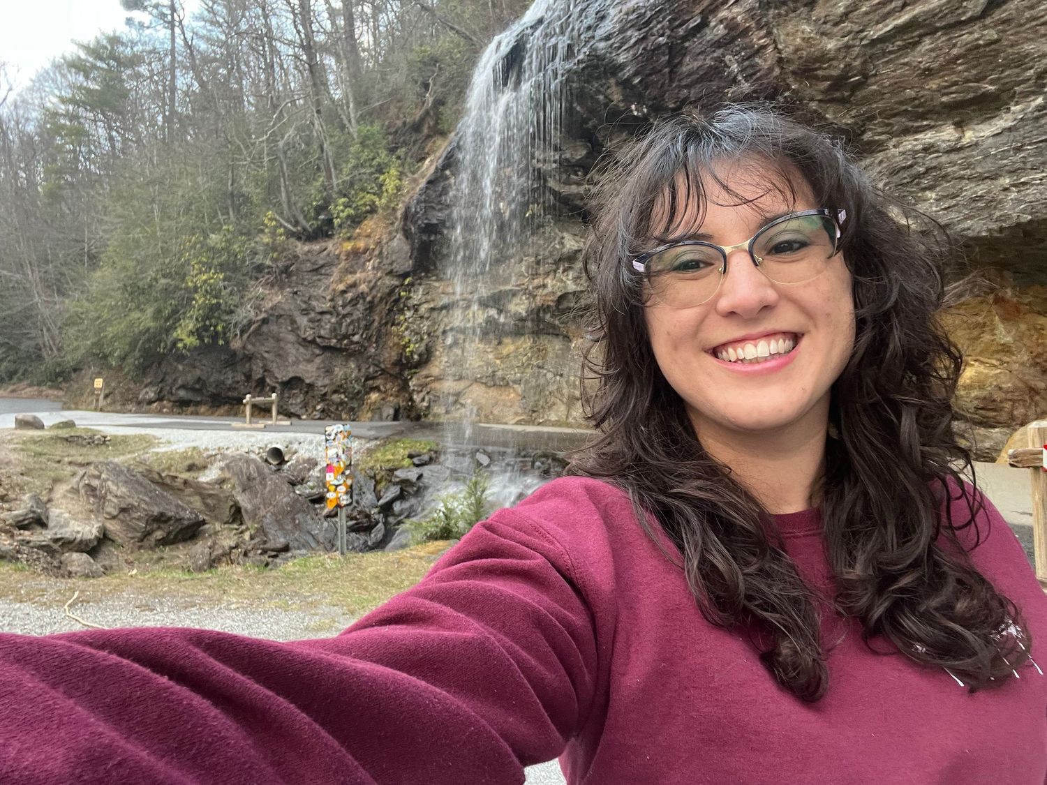 Founder in Blue Ridge Mountains along scenic waterfall drive.