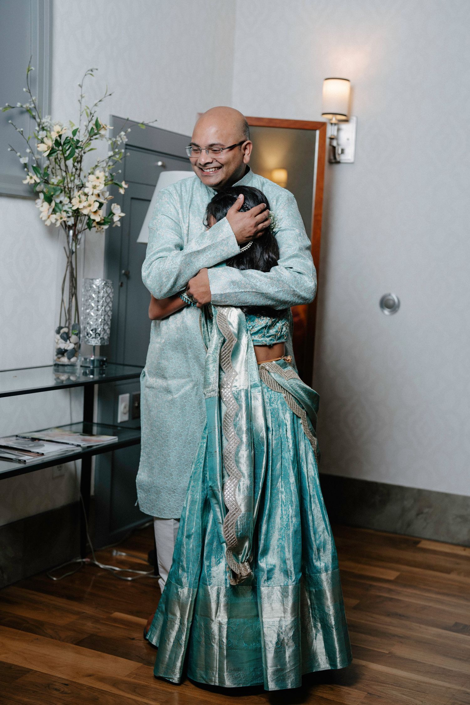 Touching sequence of a parent and child sharing an emotional embrace in formal attire.
