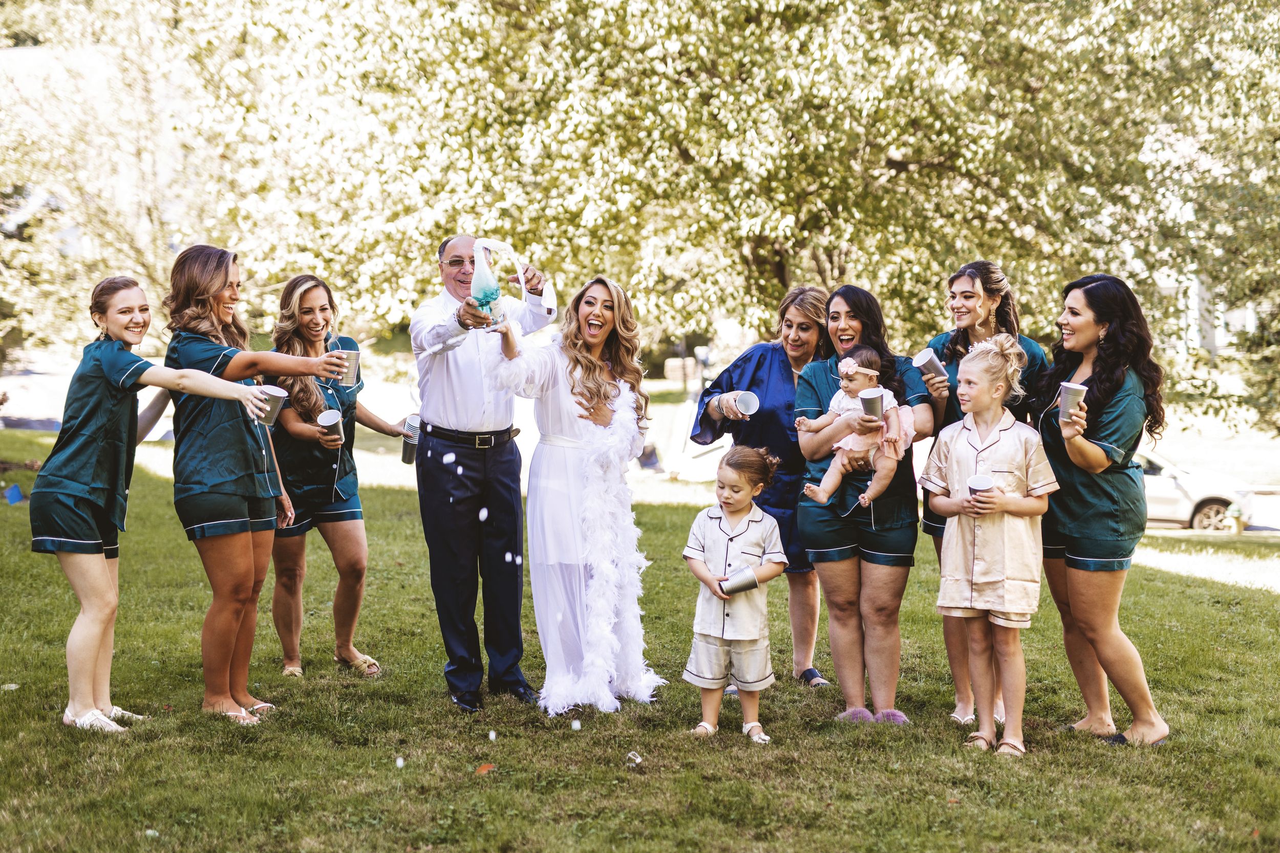 Bridal party during bride prep at a wedding with champagne toast Westchester NY