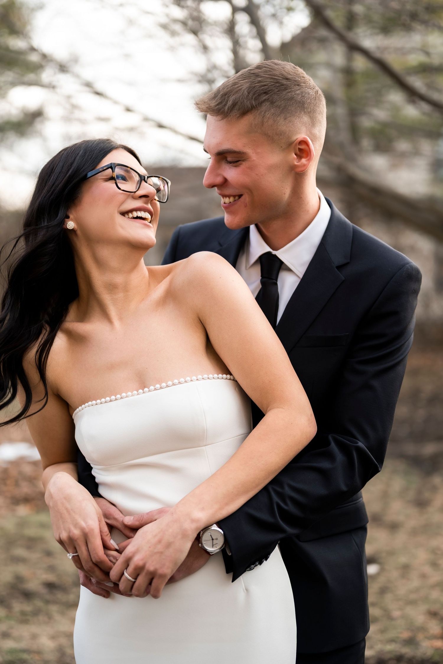 A joyful couple shares intimate moments in a series of candid wedding photos showing natural laughter and embraces.