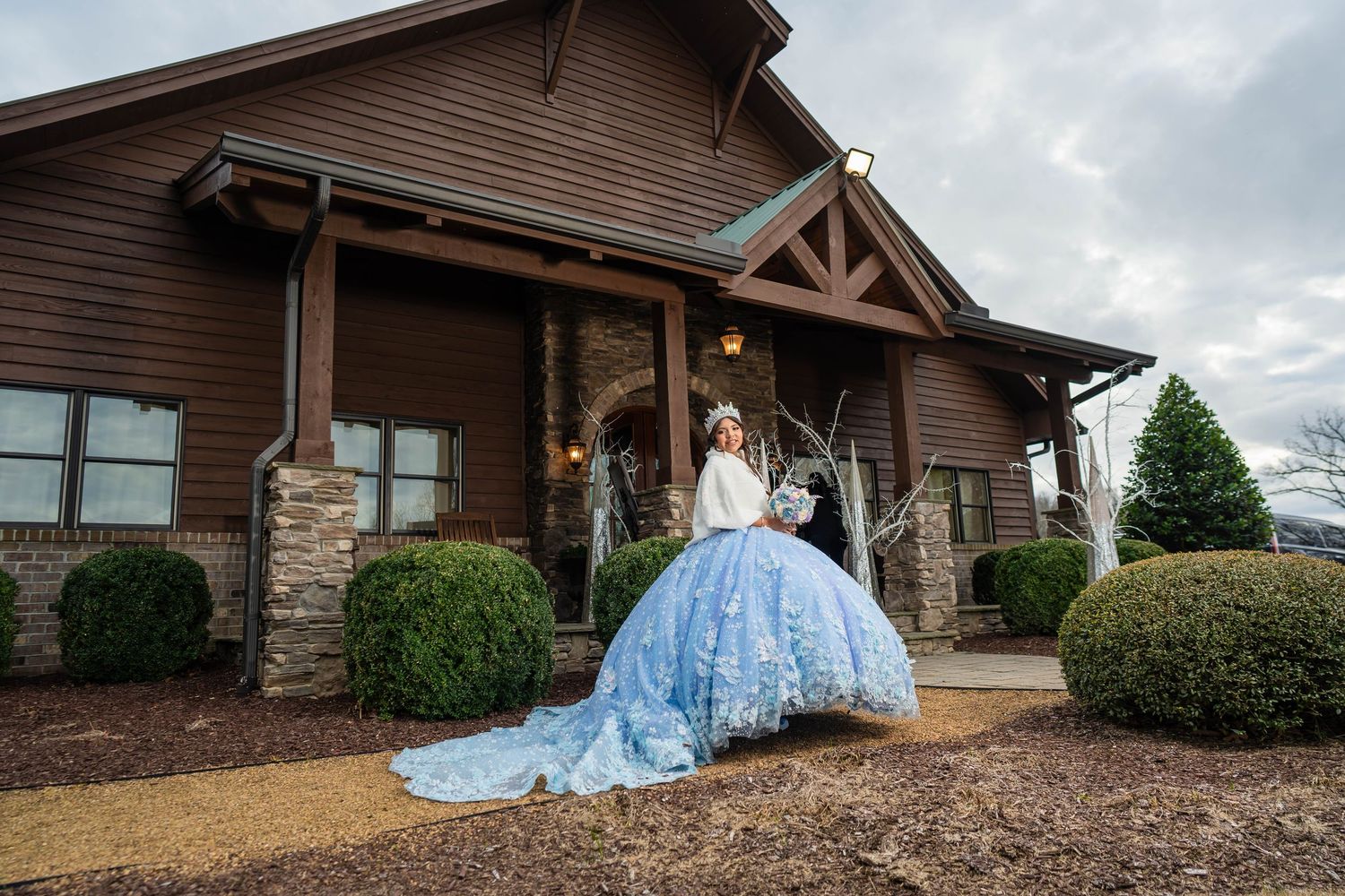 Panoramic sequence of a rustic log cabin style event venue with stone accents and wooden beams.