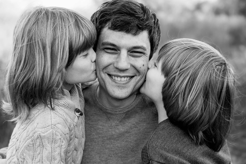 Black and white photo collage showing intimate moments between a couple in various candid poses and expressions.